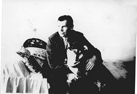 Начало 50-х годов. Петр Тимофеевич дома с собакой.